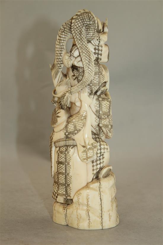 A Japanese walrus ivory okimono, early 20th century, 19cm